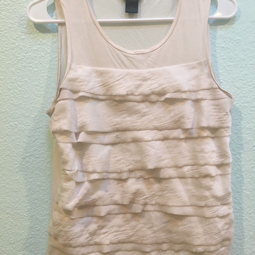 White top with ruffles.